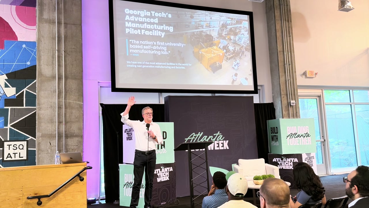 Bill Nussey gesturing toward a slide about Georgia Tech's Advanced Manufacturing Pilot Facility, the nation's first university-based self-driving manufacturing lab